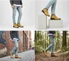 Collage of four images showing men's Timberland Euro Rock hiking boots in different settings: studio, urban street, and forest. Náhled obrázku produktu