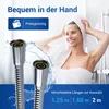 A woman with a towel on her head is in a shower, and two shower hoses are in the foreground. Produktbild-Vorschau