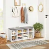 An entryway with a shoe cabinet, bench, coat rack, and decorative items. Náhľad obrázku produktu