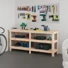 A workbench with tools and storage bins in a workshop setting. Anteprima dell’immagine prodotto