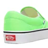 Close-up view of the heel and side of a neon green Vans slip-on shoe. Voir les images du produit