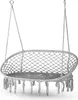 A white macrame hanging chair with tassels, suspended by ropes. Náhľad obrázku produktu