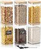Six clear glass storage jars with bamboo lids, filled with various food items and labeled. Náhled obrázku produktu