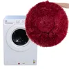 A washing machine and a round, fluffy dog bed. Náhled obrázku produktu