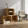 A room corner with wooden crates used as shelving, a chair with a sheepskin rug, and a round rug on the floor. Náhled obrázku produktu