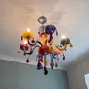 A colorful chandelier hanging from a white ceiling. Produktbild-Vorschau