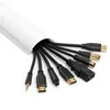 A white cable management channel with various cables emerging from it. Produktbild-Vorschau
