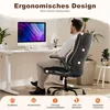 A man is sitting in an ergonomic office chair at a desk with a computer. Voir les images du produit
