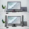 Two split images showing a computer setup with a soundbar and speakers, with musical notes floating around. Produktbild-Vorschau