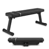 A black flat bench for home workouts, shown in both its upright and folded positions. Náhľad obrázku produktu