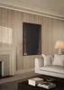 A living room scene with a fireplace, sofa, and artwork. Produktbild-Vorschau