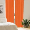 A bedroom scene with orange curtains, a bed, and a plant. Produktbild-Vorschau