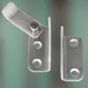 Two stainless steel door latches are shown against a blurred teal and gray background. Produktbild-Vorschau