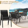 A patio dining set with chairs and a table is shown in an outdoor setting with a body of water and mountains in the background. Náhľad obrázku produktu