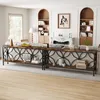 A living room scene featuring two long console tables with decorative metal fronts and wooden shelves, placed behind sofas. The tables are styled with various decorative items and books. Náhľad obrázku produktu