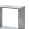 A close-up view of a concrete-style corner bookshelf. Náhled obrázku produktu