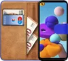 A book-style phone case with a Samsung Galaxy A21s phone inside, showing cards and money slots. Náhled obrázku produktu