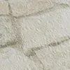 A close-up textured view of wallpaper with a brick pattern. Náhľad obrázku produktu