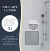 A shower mat and hooks are displayed against a light gray wall, with a shower fixture in the background. Voir les images du produit
