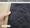 A close-up view of a quilted fabric, likely a curtain or cover, with a hand holding the edge. Produktbild-Vorschau