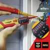 Hands holding electrical testing tools near a distribution board. Náhľad obrázku produktu