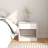 A white nightstand next to a bed with white bedding. Produktbild-Vorschau