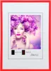 A framed picture of a woman with purple flowers in her hair and butterflies. Produktbild-Vorschau