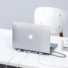 A laptop connected to a docking station on a desk. Produktbild-Vorschau