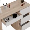 A close-up view of a vanity table with drawers open, showing makeup and a phone inside. Náhled obrázku produktu