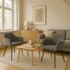 A cozy living room scene with two chairs, a coffee table, and a cabinet. Anteprima dell’immagine prodotto