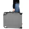 A person is holding a folded gray sun lounger. Anteprima dell’immagine prodotto