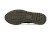 The sole of a brown shoe is shown against a white background. Voir les images du produit