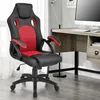 A gaming chair is positioned next to a desk with a computer monitor. Náhled obrázku produktu