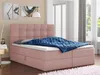 A pink boxspring bed with a blue blanket and pillows in a bedroom setting. Produktbild-Vorschau