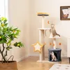 A cat tree with two cats in a living room setting, next to a potted plant. Anteprima dell’immagine prodotto