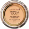 A top-down view of a round makeup foundation container with a clear lid and a beige-colored product inside. Náhľad obrázku produktu