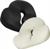 Two orthopedic seat cushions, one black and one white, are shown against a white background. Podgląd zdjęcia produktu
