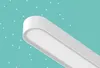 A close-up of a white, modern-looking light fixture against a teal background with white dots. Podgląd zdjęcia produktu