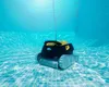 A pool cleaning robot is submerged underwater in a tiled swimming pool. Produktbild-Vorschau