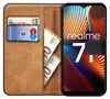 A book-style phone case with a Realme 7i phone inside, along with some euro banknotes and a bank card. Produktbild-Vorschau