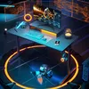 A futuristic gaming setup with a desk, monitor, keyboard, and accessories, illuminated by neon lights. Anteprima dell’immagine prodotto
