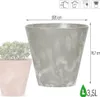 A close-up of a gray plant pot with a textured finish, next to a pink pot with a plant. Dimensions and capacity are indicated with text and icons. Produktbild-Vorschau