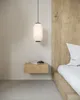 A bedroom scene with a bedside table and a bed. Produktbild-Vorschau