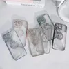 Several iPhone cases with diamond embellishments are laid out on a white surface. Produktbild-Vorschau