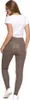 A woman is shown from the back wearing beige leggings and a white t-shirt. Produktbild-Vorschau