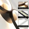 Close-up view of a modern LED ceiling lamp with multiple rings, featuring inset images highlighting its materials and lighting. Voir les images du produit