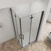 A modern shower enclosure with black frames and clear glass panels, set against a white brick wall and wooden floor. Produktbild-Vorschau
