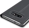 Close-up of a dark gray flip case for a smartphone, showing the camera cutout and the edge of the phone. Anteprima dell’immagine prodotto