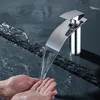 Hands washing under a modern waterfall faucet. Produktbild-Vorschau