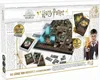 The image shows the packaging of a Harry Potter board game, featuring the game board, cards, and a character illustration. Produktbild-Vorschau